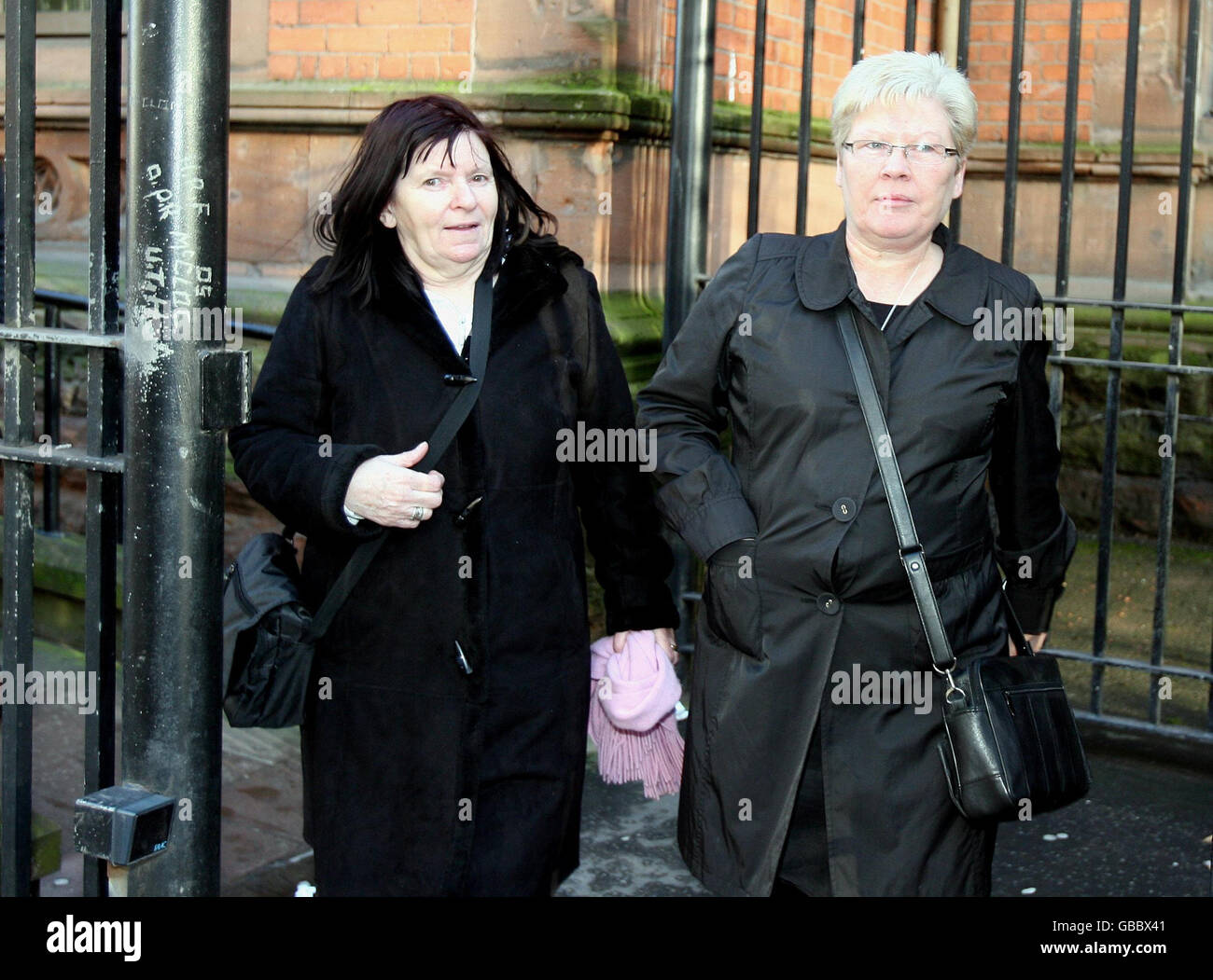 The mother of IRA man Pearse Jordan, Teresa Jordan (left) leaves a  preliminary inquest into her sons shooting at the Coroners Court in  Belfast, with Marie Cush, a Sinn Fein Councillor Stock