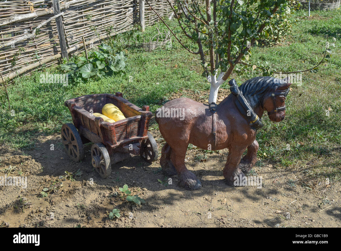 Wooden toy horse and cart. Decorations in the courtyard Stock Photo Alamy
