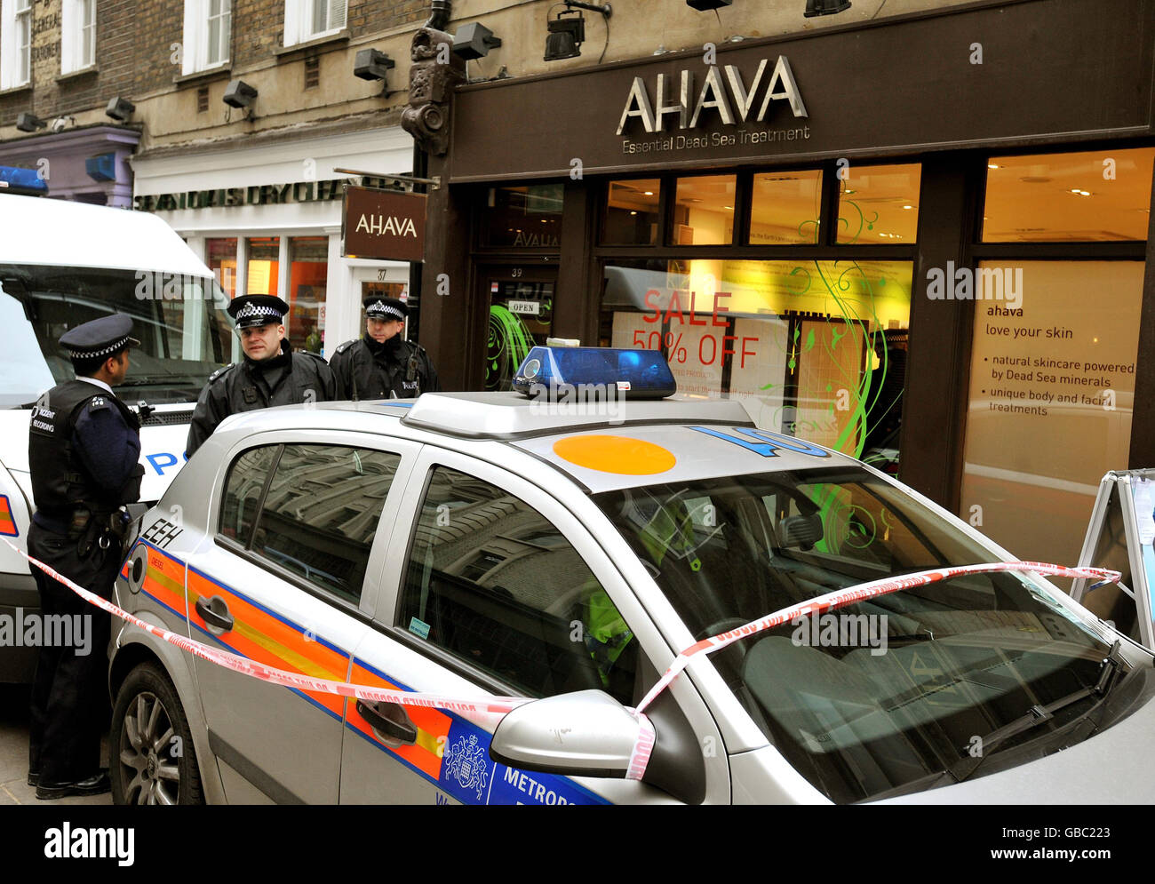 Metropolitan Police officers stand outside the Ahava shop in Monmouth street in central London, where protesters occupied the Israeli-owned shop. Stock Photo