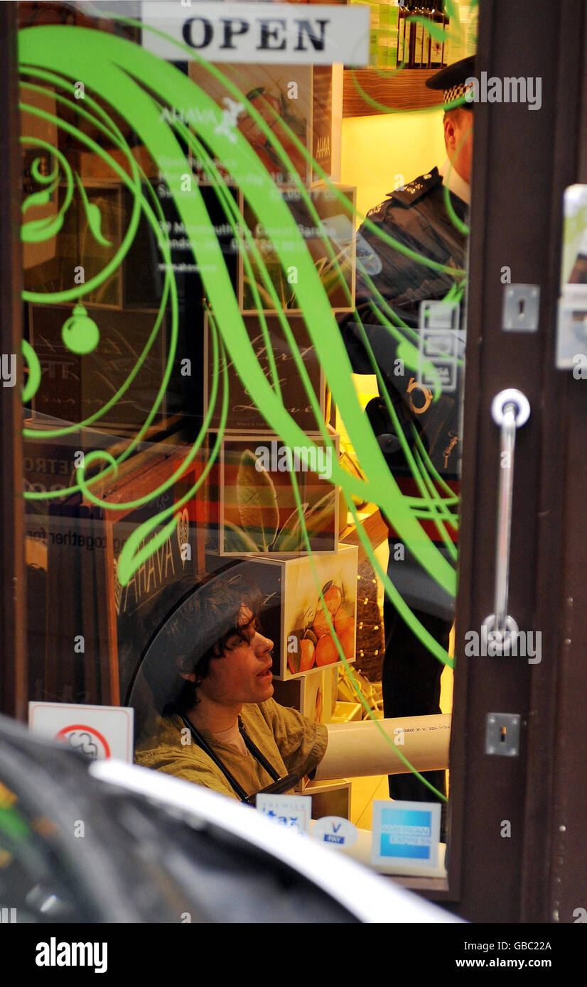 A protester inside the Ahava shop in Monmouth street in central London, where protesters occupied the Israeli-owned shop forcing it to close. Stock Photo