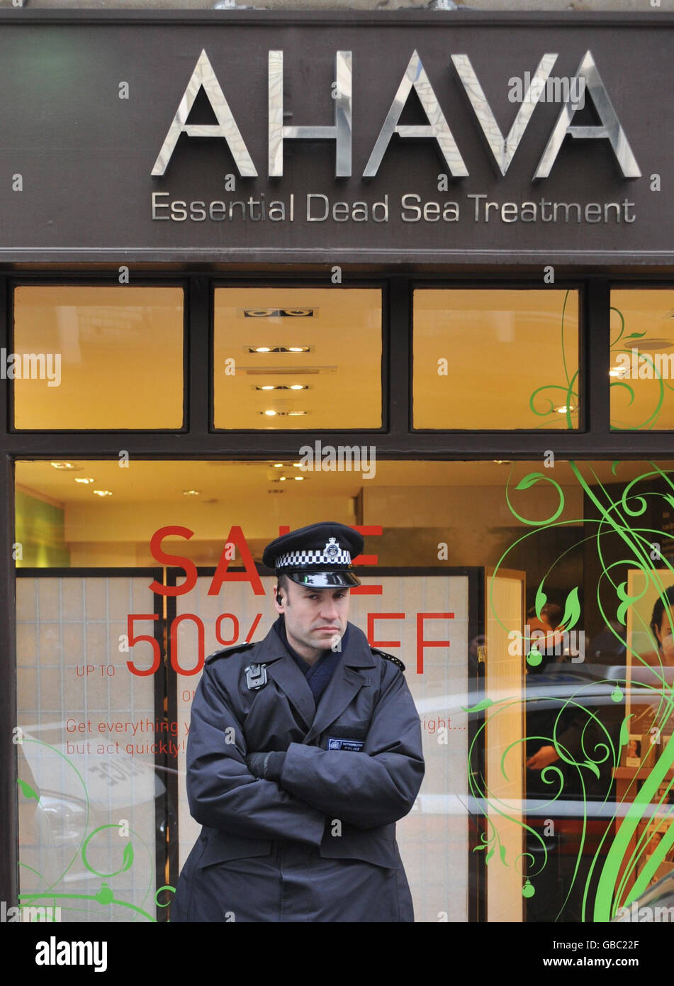 A Metropolitan Police officer stands outside the Ahava shop in Monmouth street in central London, where protesters occupied the Israeli-owned shop. Stock Photo