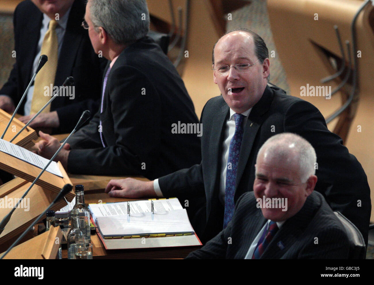 Scottish Cabinet Secretary for Finance John Swinney (second right)at the start of the finance debate in the Scottish Parliament Edinburgh. Stock Photo