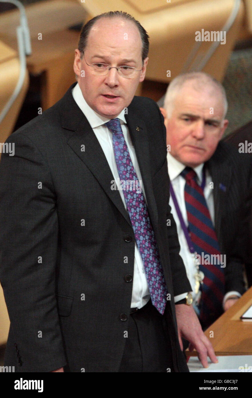 Scottish Cabinet Secretary for Finance John Swinney (left) at the start of the finance debate in the Scottish Parliament Edinburgh. Stock Photo