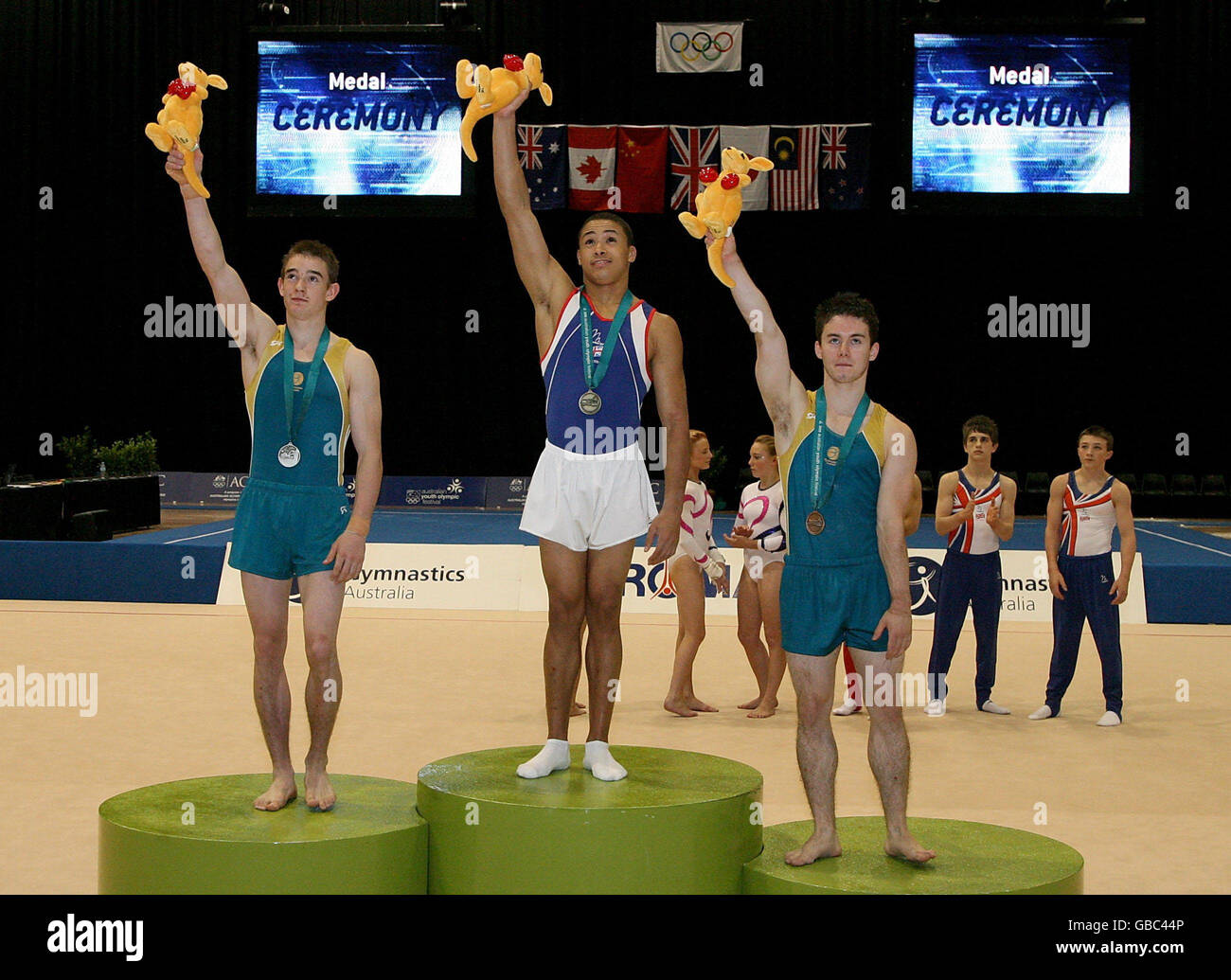 Great Britain Reiss Beckford wins gold in the Floor with Sean O'Hara (left), Silver and Luke Wadsworth (right) both of Australia in the Artistic Gymnastics Apparatus Final during the Australian Youth Olympic Festival 2009 at Sydney Olympic Park, Sydney, Australia. Stock Photo