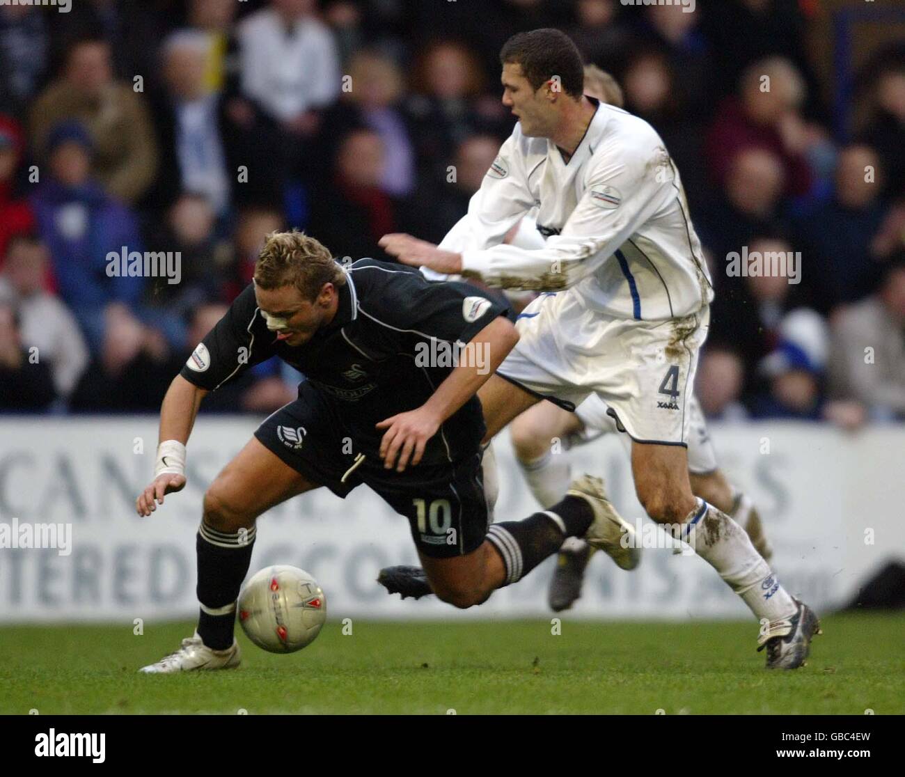 Soccer - AXA FA Cup - Fifth Round - Tranmere Rovers v Swansea City. Tranmere Rovers' Graham Allen and Swansea City's Lee Trundle battle for the ball Stock Photo