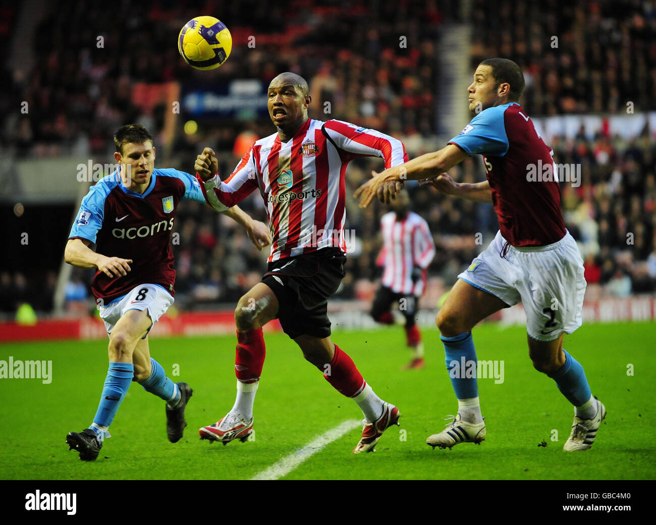 Sunderland's El-Hadji Douf and Aston Villa's James Milner (left) and Luke Young during the Barclays Premier League match at the Stadium of Light, Sunderland. Stock Photo
