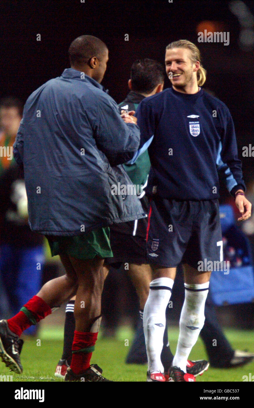 Soccer - International Friendly - Portugal v England. Portugal's Jorge Andrade (l) shakes hands with England's David Beckham Stock Photo