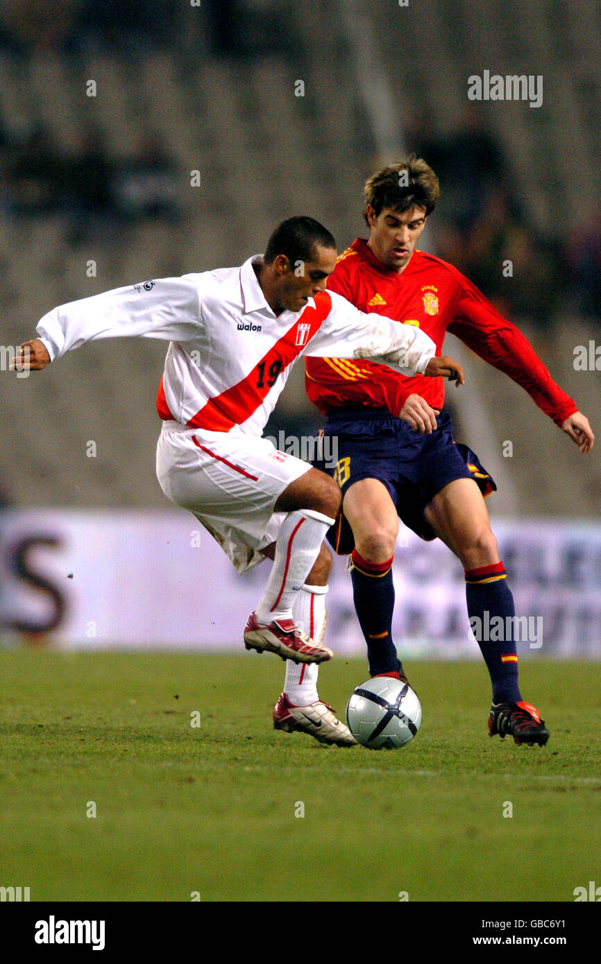 Soccer - International Friendly - Spain v Peru. Spain's David Albelda (r) and Peru's Marko Ciurlizza (l) battle for the ball Stock Photo
