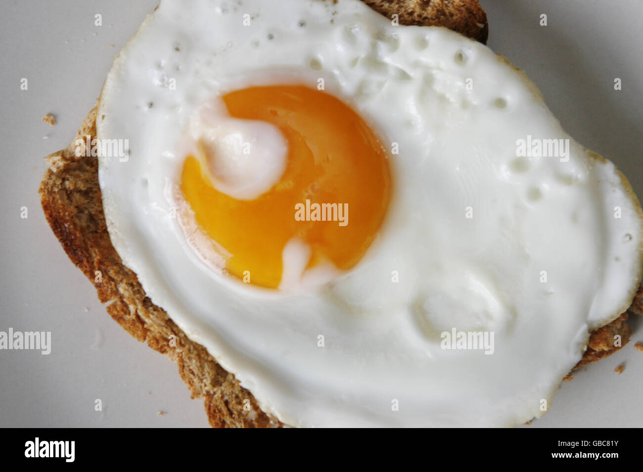 Breakfast cereal stock. A fried egg on wholemeal toast Stock Photo Alamy