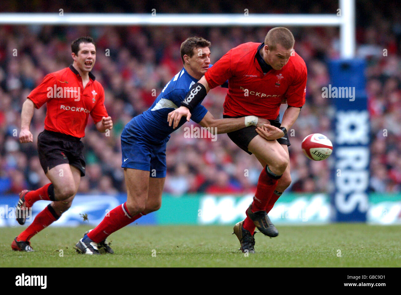 Rugby Union - The RBS Six Nations Championship - Wales v France. Wales' Gethin Jenkins spills the ball as he is tackled by France's Nicolas Brusque (c) Stock Photo
