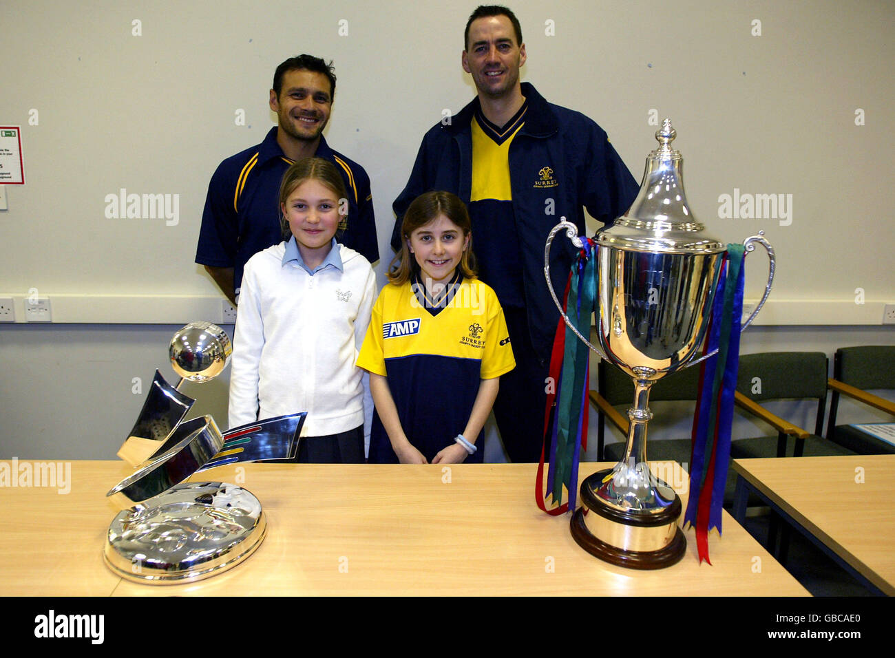 Surrey's Mark Ramprakash (l) and Martin Bicknell with young Surrey fans