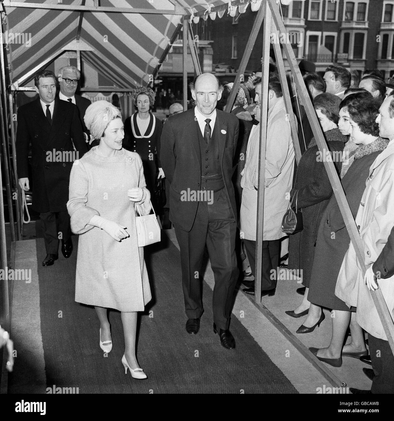 Princess Margaret arriving with her husband, the Earl of Snowden (behind) for a visit to the International Furniture Show at Earl's Court, London. Stock Photo