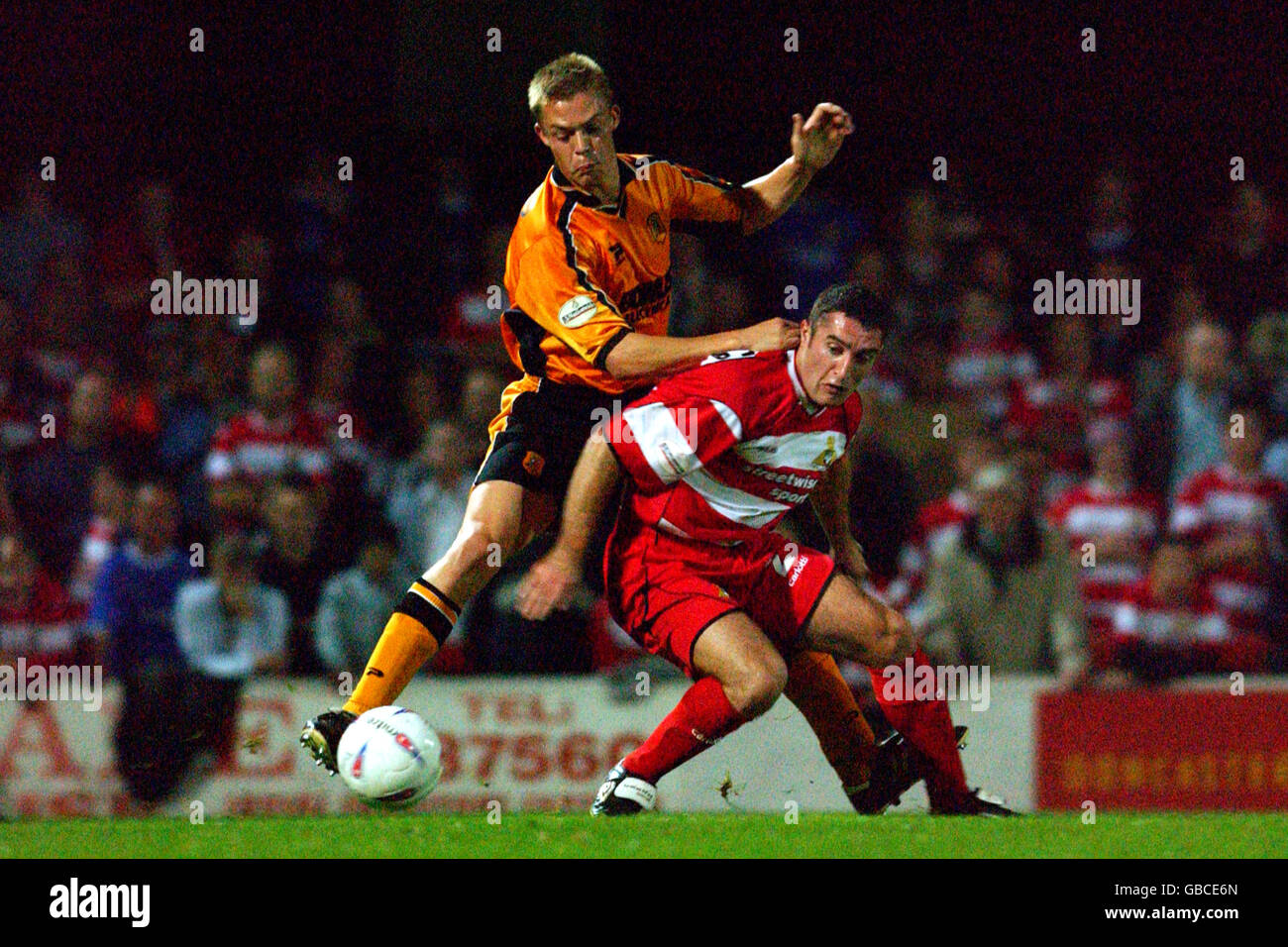 Soccer - Nationwide League Division Three - Doncaster Rover v Hull City. Hull City's Danny Allsopp (l) challenges Doncaster Rover's Simon Marples (r) from behind Stock Photo