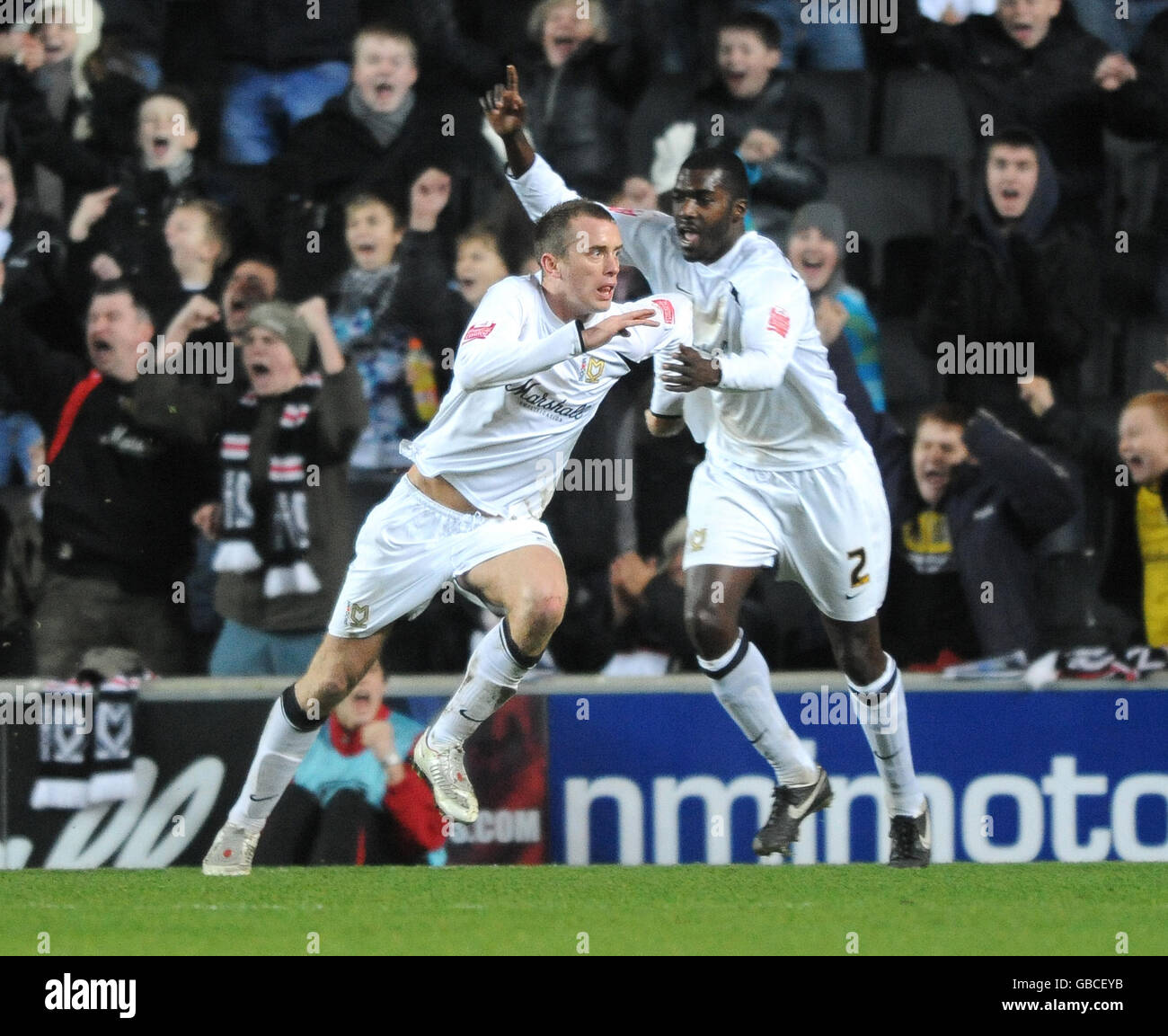 Milton Keynes Dons' Aaron Wilbraham celebrates scoring against Colchester United Stock Photo