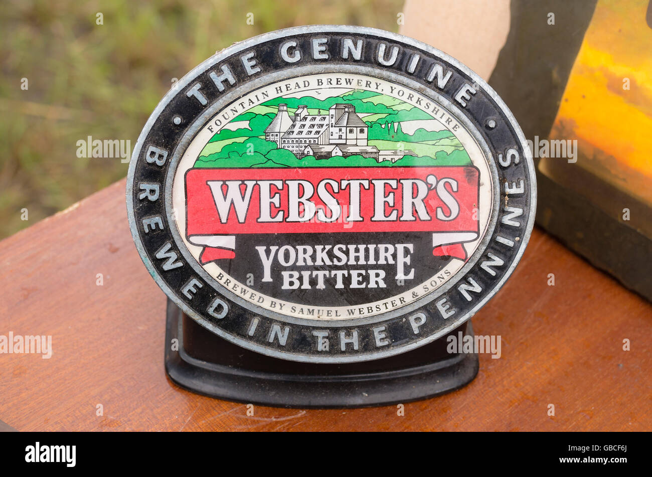 An original beer pump identifying label for Webster's Yorkshire bitter ale on a market stall in UK Stock Photo