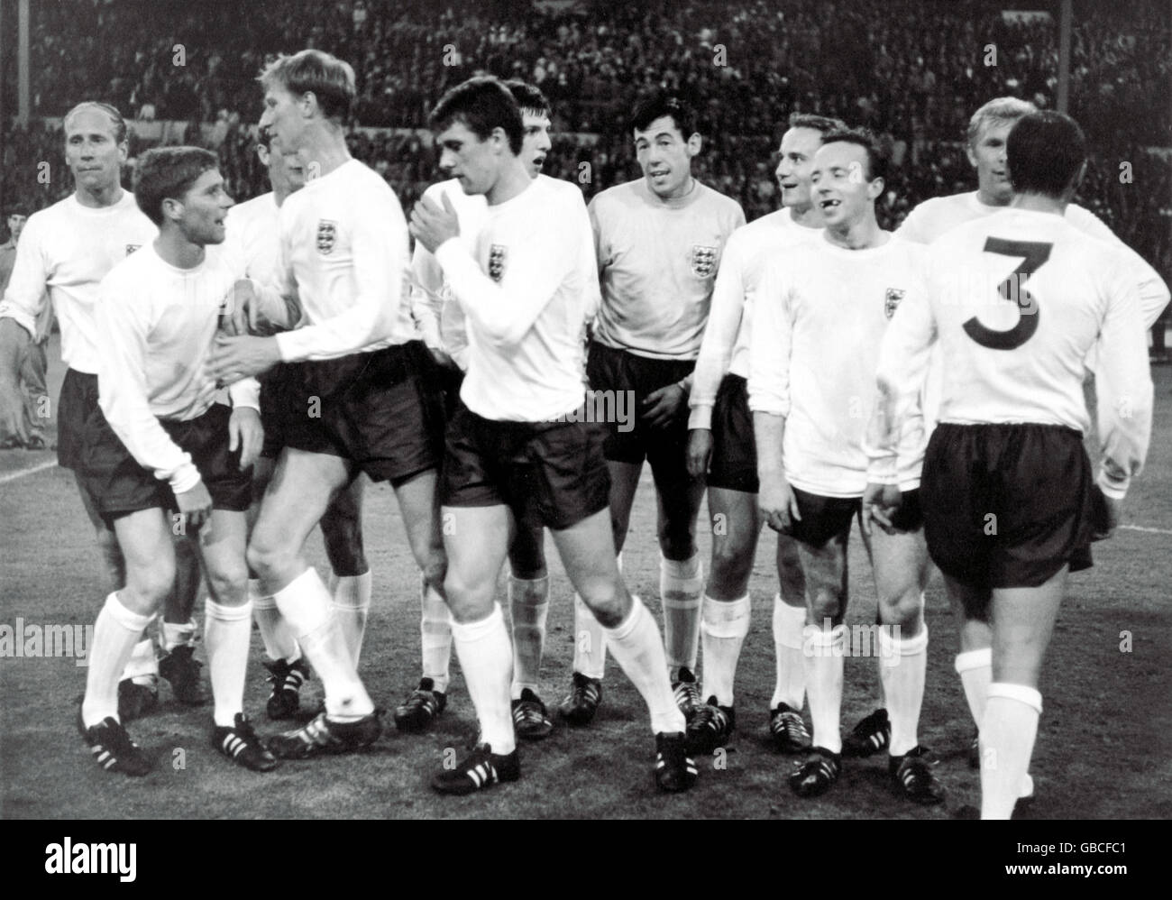 England players celebrate reaching the World Cup Final after their 2-1 win: (l-r) Bobby Charlton, Alan Ball, Roger Hunt, Jack Charlton, Geoff Hurst, Martin Peters (behind), Gordon Banks, George Cohen, Nobby Stiles, Bobby Moore, Ray Wilson Stock Photo