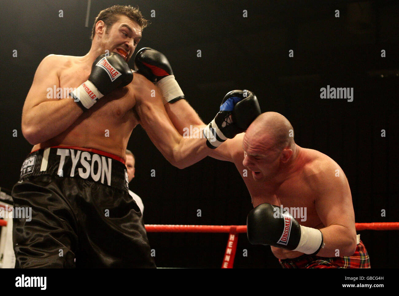 Tyson Fury (left) beats Marcel Zeller on the undercard of the British Lightweight Title fight at the Robin Park Centre, Wigan. Stock Photo