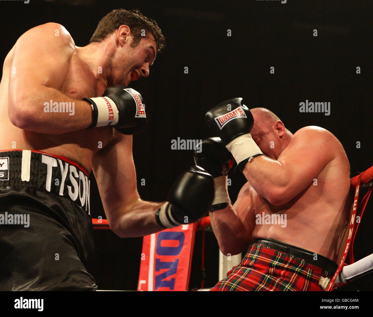 Tyson Fury (left) beats Marcel Zeller on the undercard of the Lightweight Title fight at the Robin Park Centre, Wigan. Stock Photo