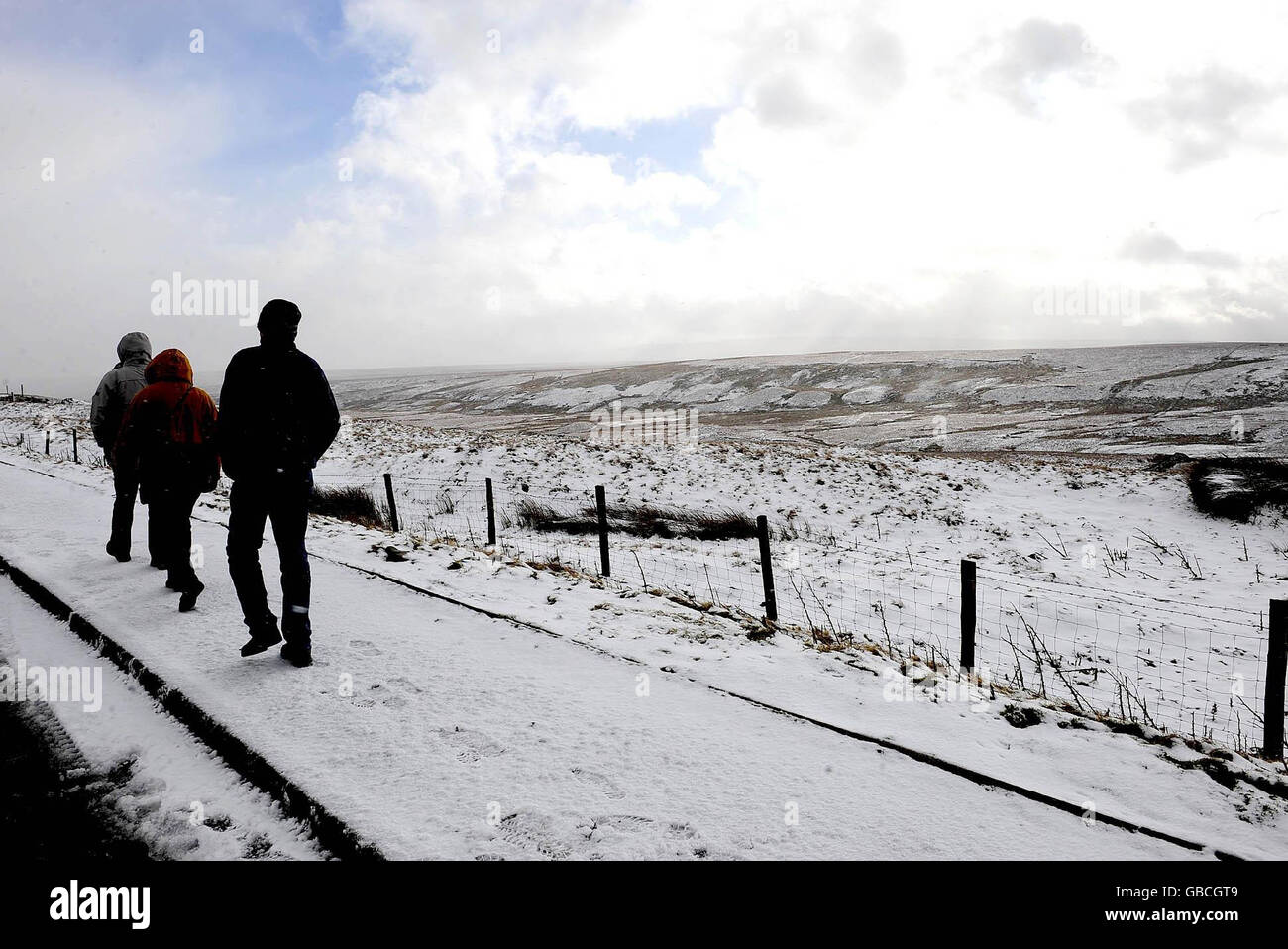 Walkers in the North Pennines near Bowes, after severe weather caused havoc in parts of the country. Stock Photo