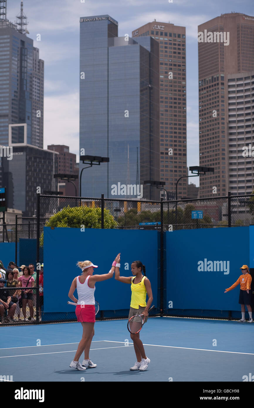 Anne Keothavong and Mervana Jugic-Salkic celebrate winning a game during their doubles victory over Sophie Ferguson and Jessica Moore during the Australian Open 2009 at Melbourne Park, Melbourne, Australia. Stock Photo