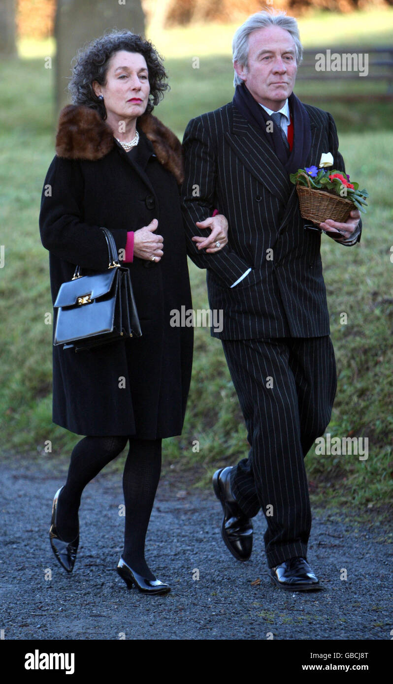 Roddy Llewellyn, brother of Sir Dai Llewellyn, and wife Tatiana arrive at St Marys Church, for his brothers funeral, Coddenham, Suffolk. Stock Photo