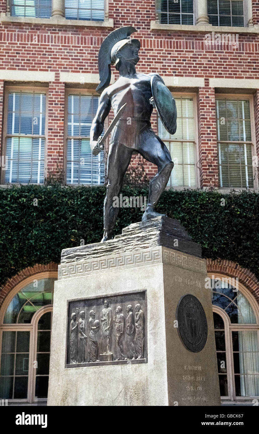 'Tommy Trojan' is a well-known bronze sculpture by Roger Noble Burnham of the unofficial collegiate mascot of the University of Southern California (USC) in Los Angeles, California, USA. Holding a shield and drawn sword, the muscular figure was unveiled in 1930 as a symbol of the school's fighting spirit. On one side of the statue's base is a large bronze plaque by Burnham depicting Helen of Troy. Another side displays the university seal and five words describing the ideal Trojan: Faithful, Scholarly,Skillful, Courageous and Ambitious.The Trojan statue is a popular meeting place for students. Stock Photo