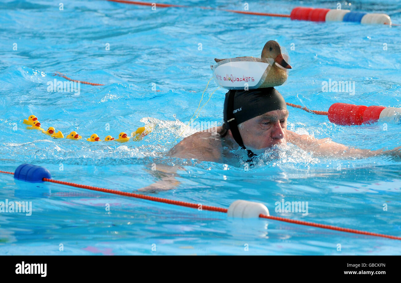 A charity swimmer participates in National Cold Water Swimming Championship at Tooting Bec, London today. Stock Photo