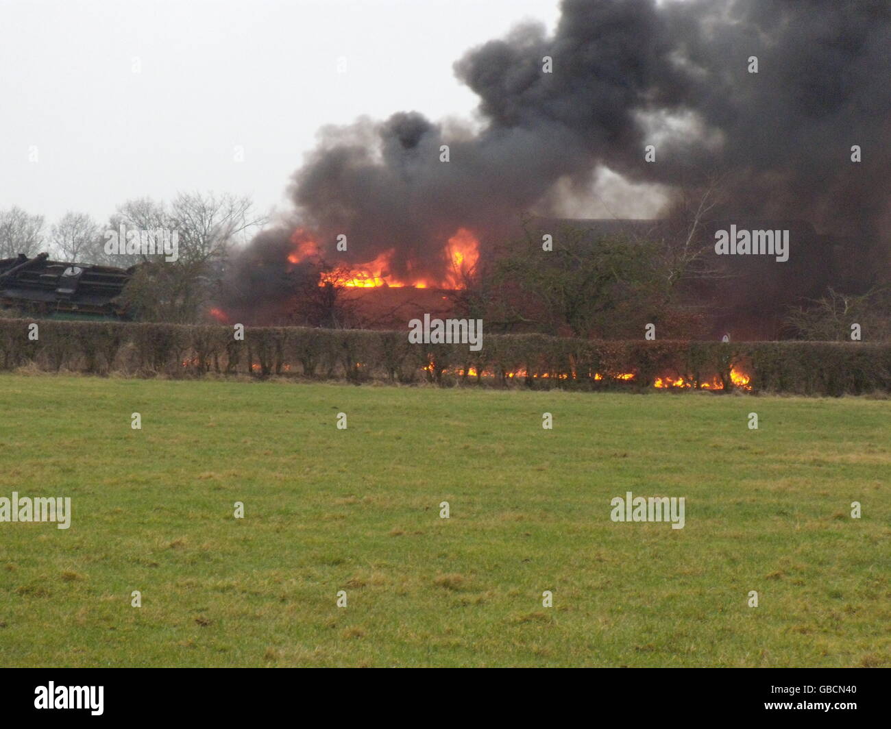 The scene of an intensive blaze after a freight train carrying fuel derailed and caught fire near Stewarton in Ayrshire. Stock Photo