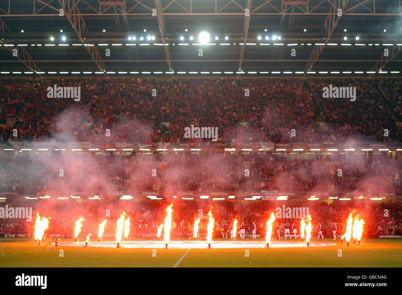 Fireworks go off on the pitch at the Millennium stadium before kick off Stock Photo