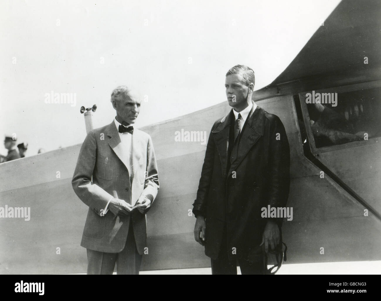 The Lone Eagle, Charles A. Lindbergh, stands with Henry Ford beside the 'Spirit of St. Louis,' the plane in which Col. Lindbergh flew the first trans-Atlantic solo flight in 1927. Stock Photo