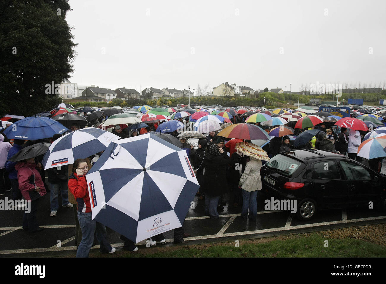 Thousands gather in support of workers and former employees at Waterford Crystal, who spent the night occupying the main visitor centre at the company's factory in Kilbarry, Waterford. Stock Photo