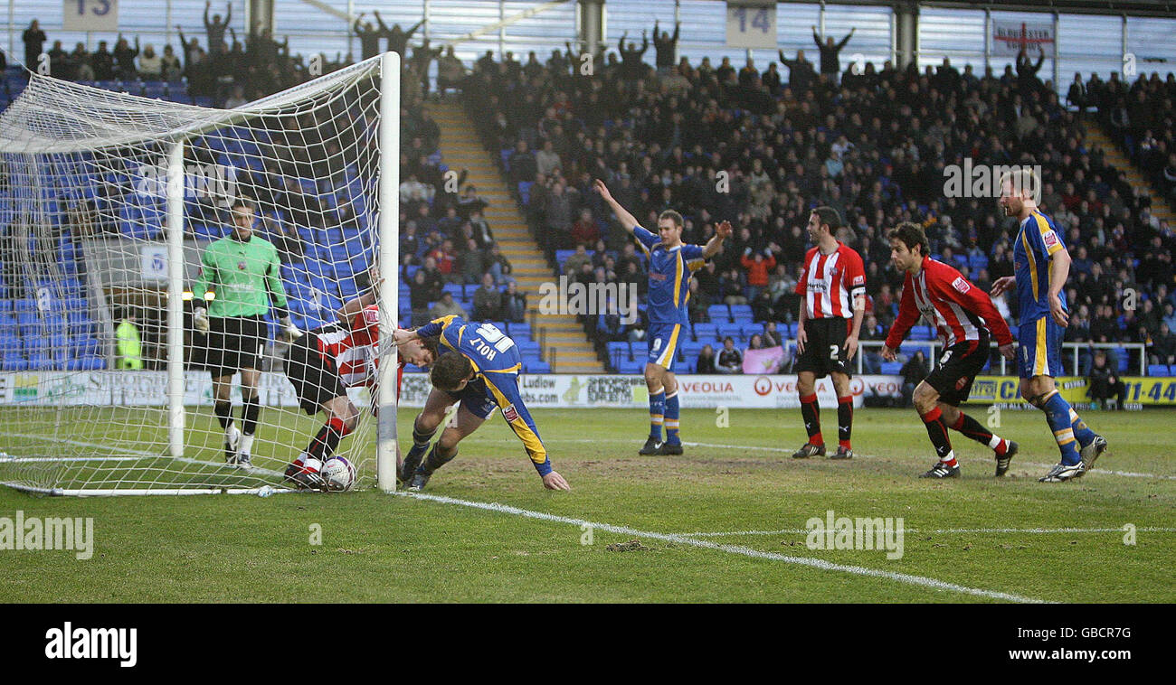 Shrewsbury Town's Grant Holt scores during the Coca-Cola League Two match at the Prostar Stadium, Shrewsbury. Stock Photo