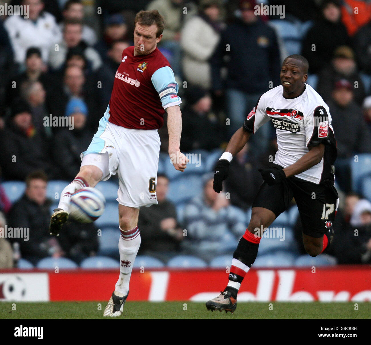 Burnley's Stephen Caldwell and Charlton Athletic's Chris Dickson during the Coca-Cola Championship match at Turf Moor, Burnley. Stock Photo