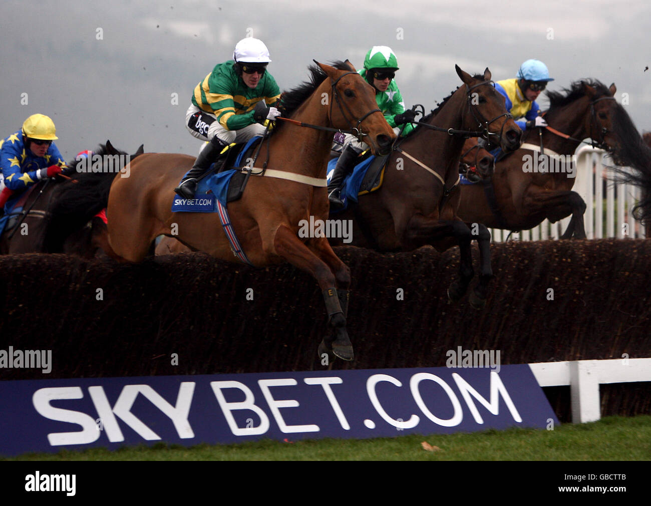 Tony McCoy on Don't Push It jumps a fence during the Unicoin Homes Handicap Hurdle Chase Stock Photo