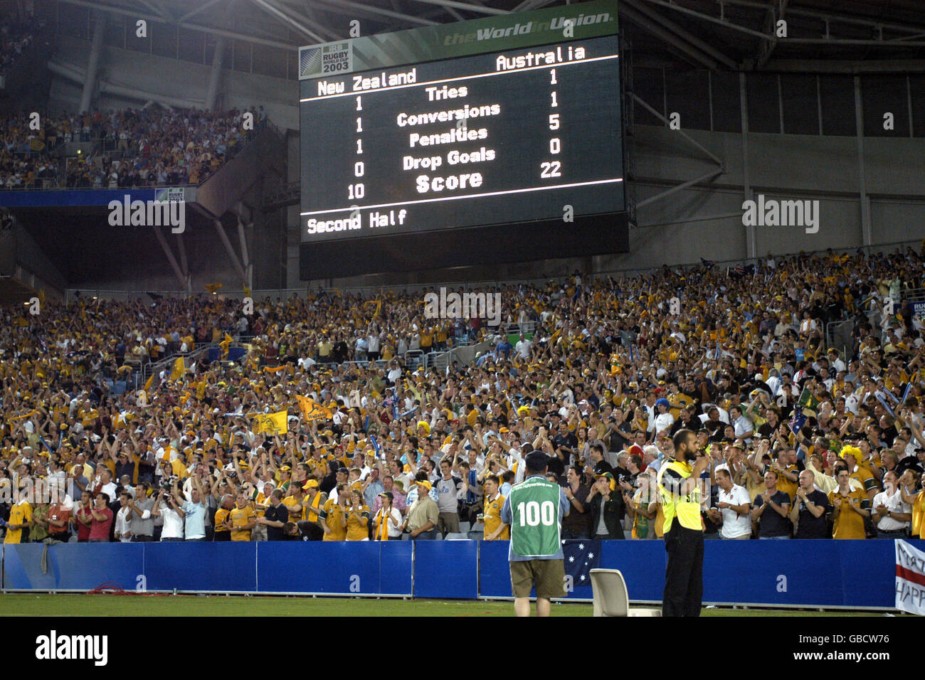 The scoreboard shows he final score as the Austrailian fans celebrate their victory over New Zealand Stock Photo