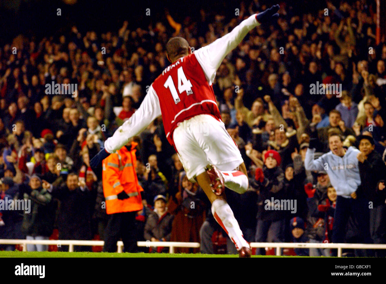 Arsenals thierry henry runs off in celebration of his goal hi-res stock