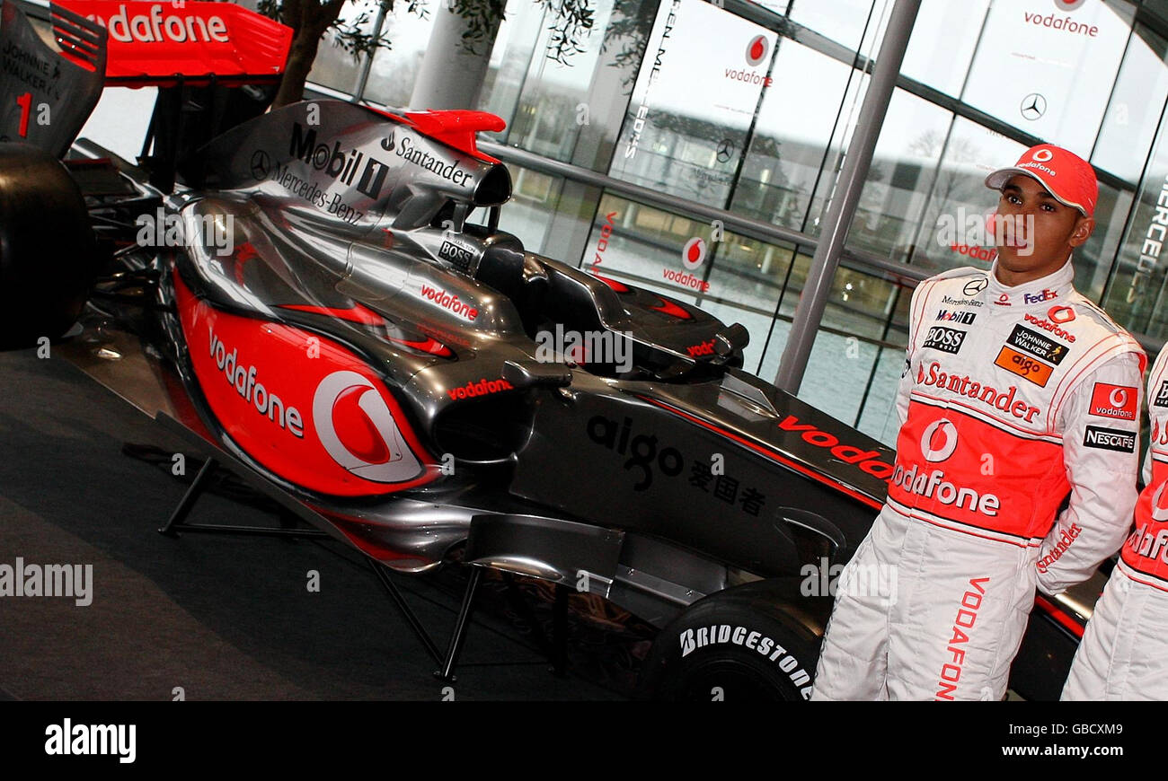 Vodafone McLaren Mercedes driver Lewis Hamilton next to the new McLaren MP4- 24 during the McLaren Mercedes Formula One Launch at the Technology Centre  in Woking, Surrey Stock Photo - Alamy