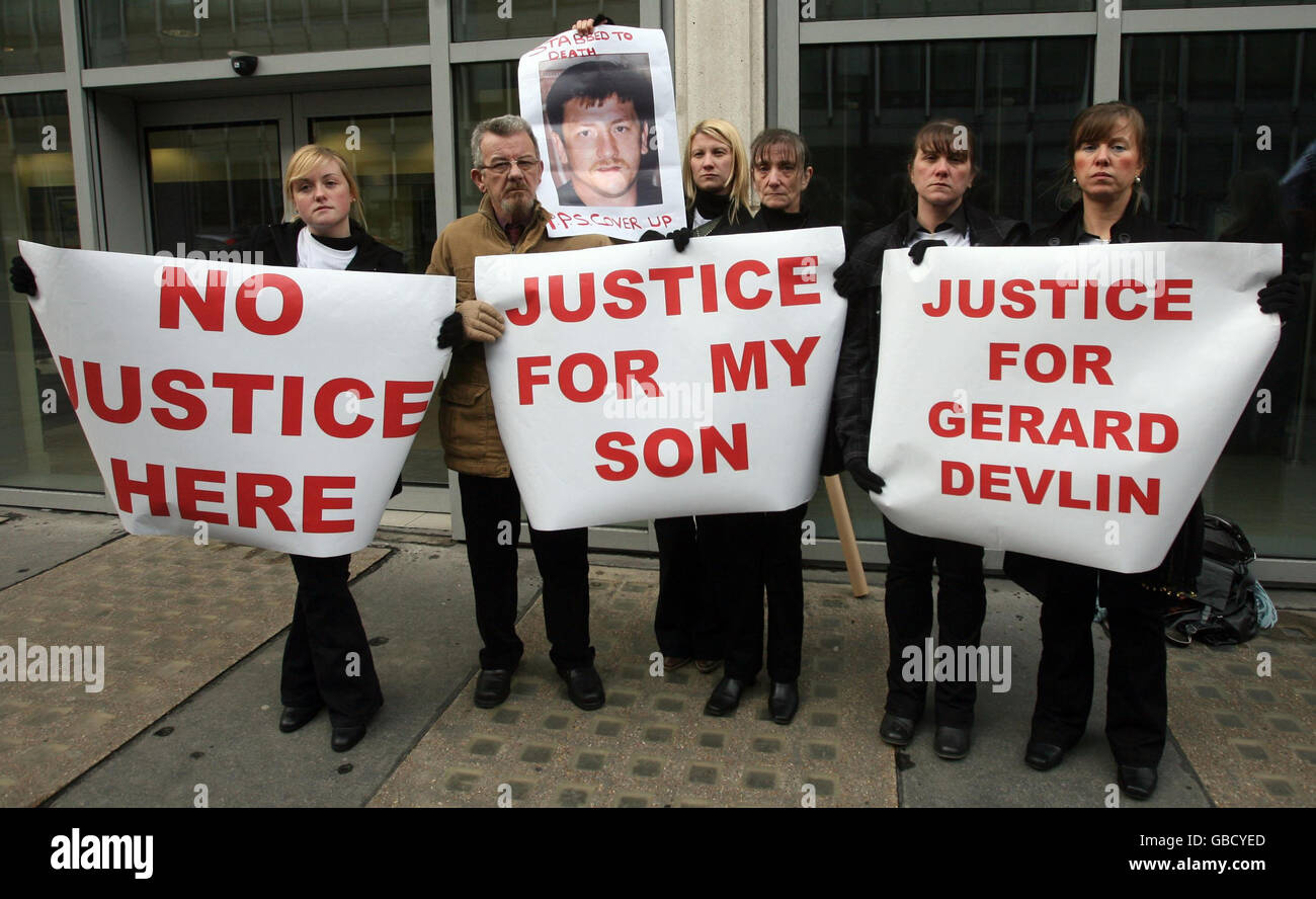 Friends and family of Gerard Devlin protest outside the Attourney General's Office on Victoria Street in London. Stock Photo