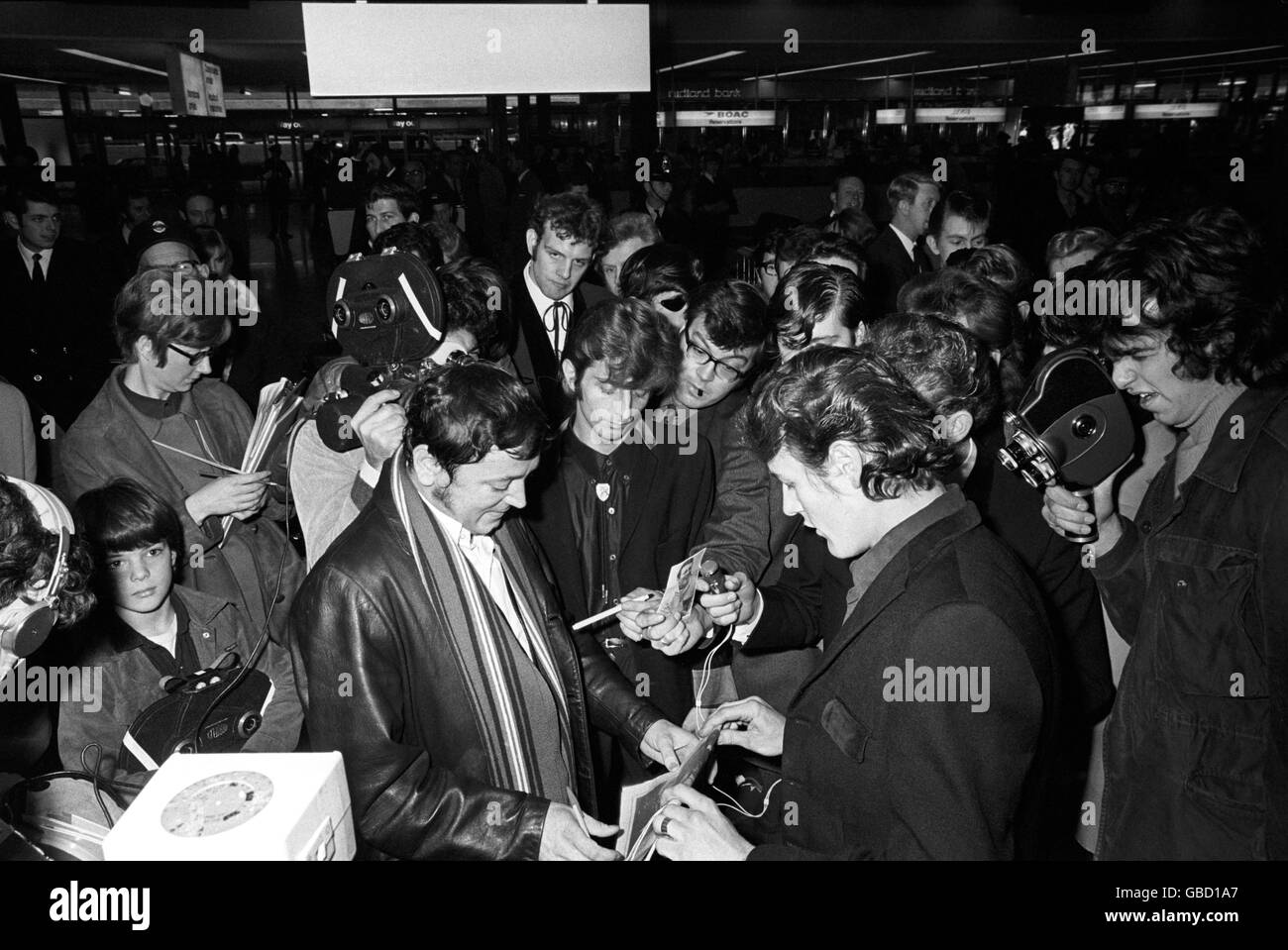 Music - Gene Vincent - Heathrow Airport - London - 1969. Fans mob rock n roll singer Gene Vincent for his autograph on arrival at Heathrow Airport from Paris. Stock Photo
