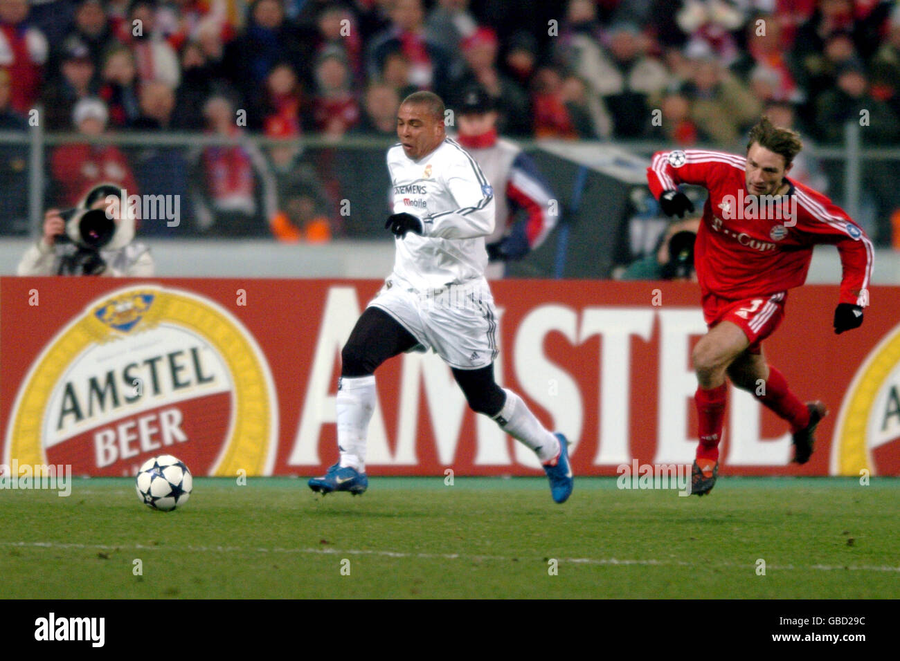 (L-R) Ronaldo, Real Madrid breaks away from Bayern Munich's Robert Kovac Stock Photo