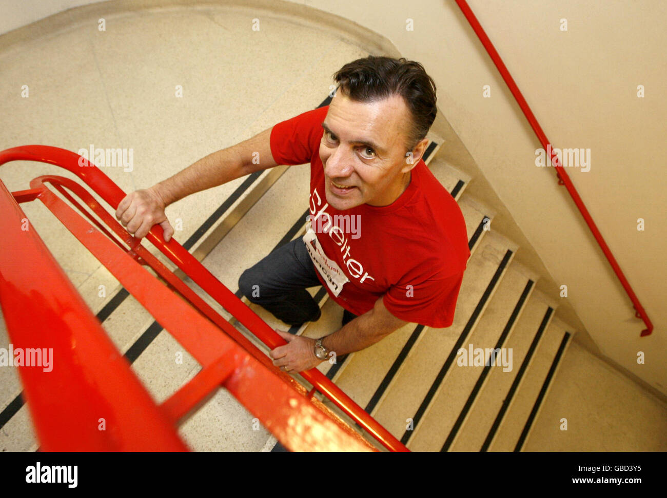 Duncan Bannatyne stands on the first few steps of the stairwell inside Tower 42 in the City of London, as he launches Vertical Rush, an endurance event that challenges people to run up the stairs of the tower in the fastest time possible to raise money for the housing charity Shelter. Stock Photo