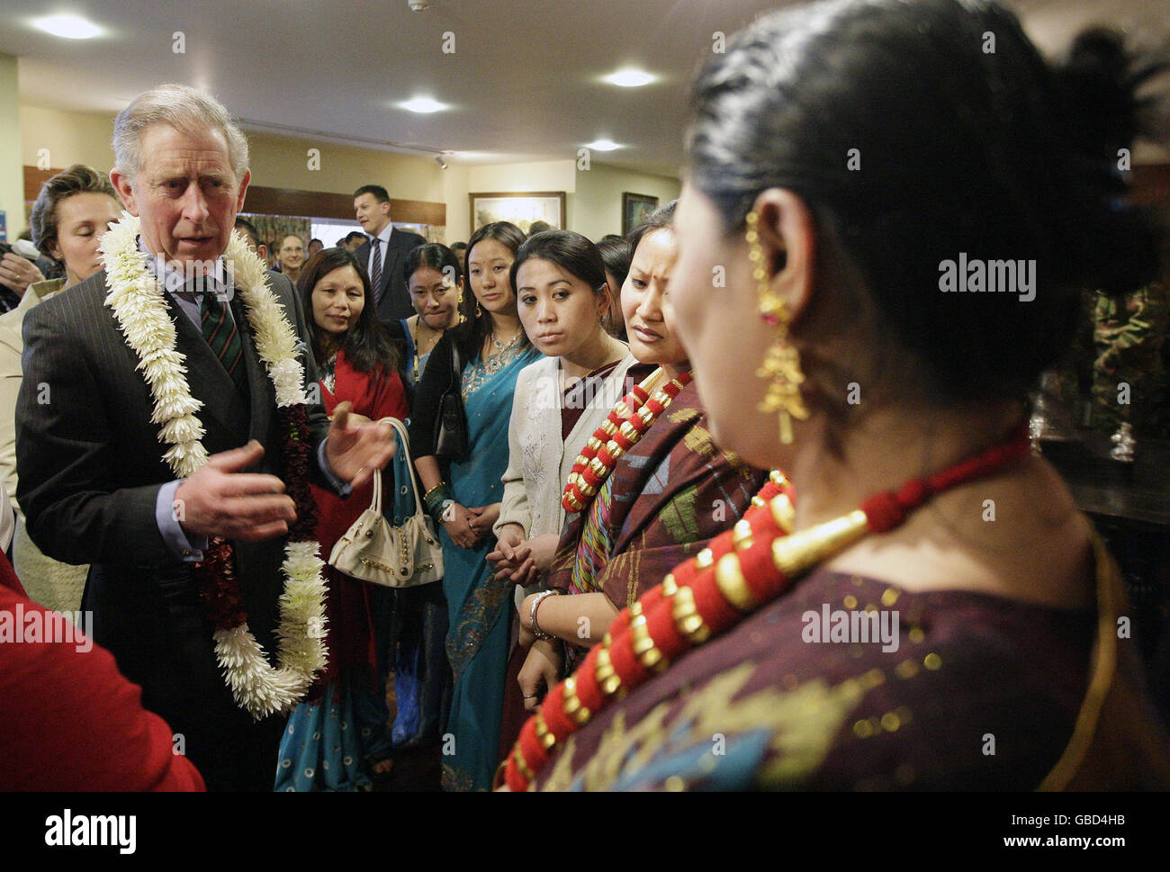 The Prince of Wales (left) talks to families of the 2nd Battalion The Royal Gurkha Rifles (2 RGR), stationed at Sir John Moore Barracks in Folkestone. Stock Photo