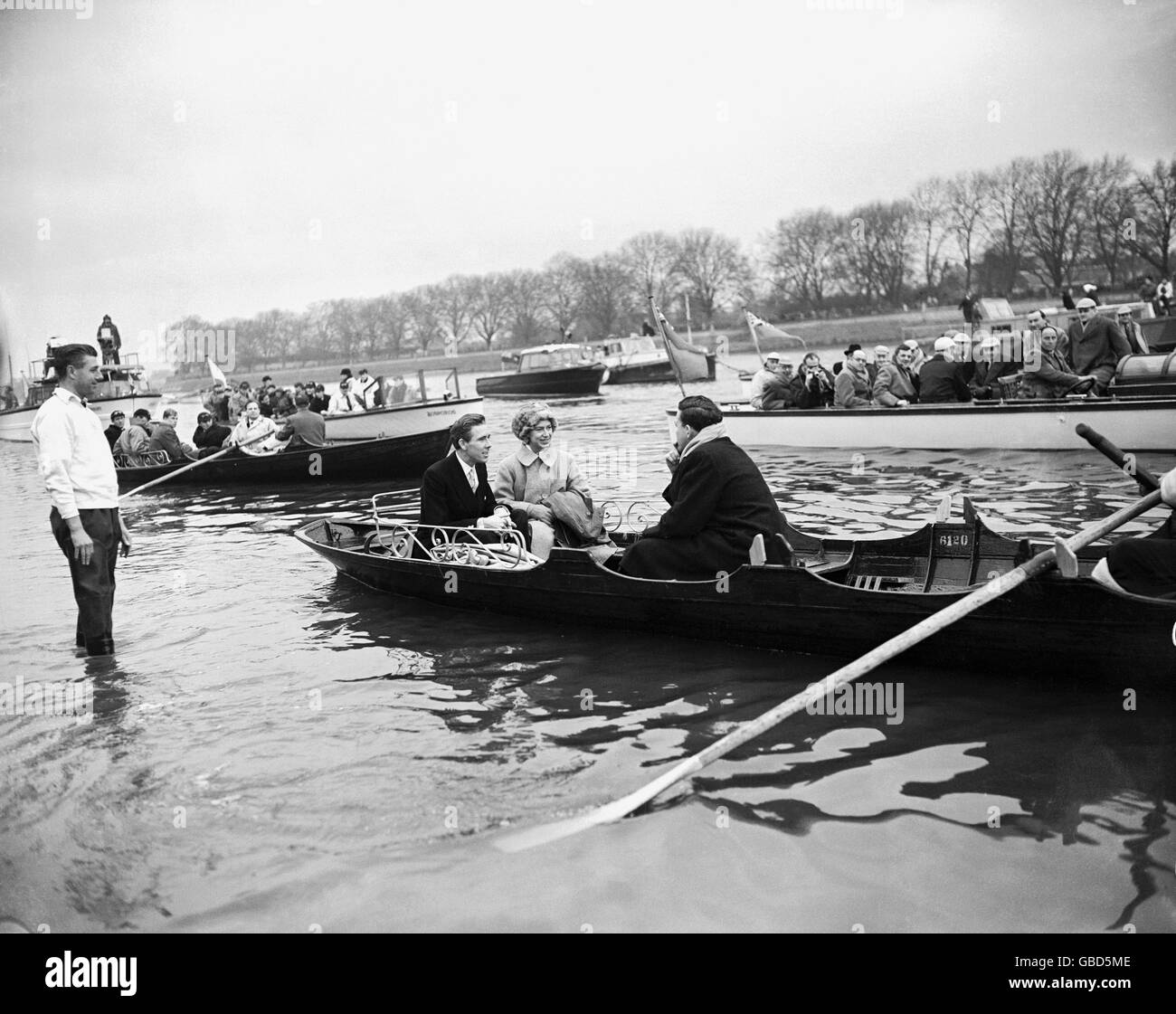 HRH Princess Margaret and her husband Lord Snowdon, who rowed for Cambridge in 1950, are rowed out to the Cambridge launch to watch the race from the water Stock Photo