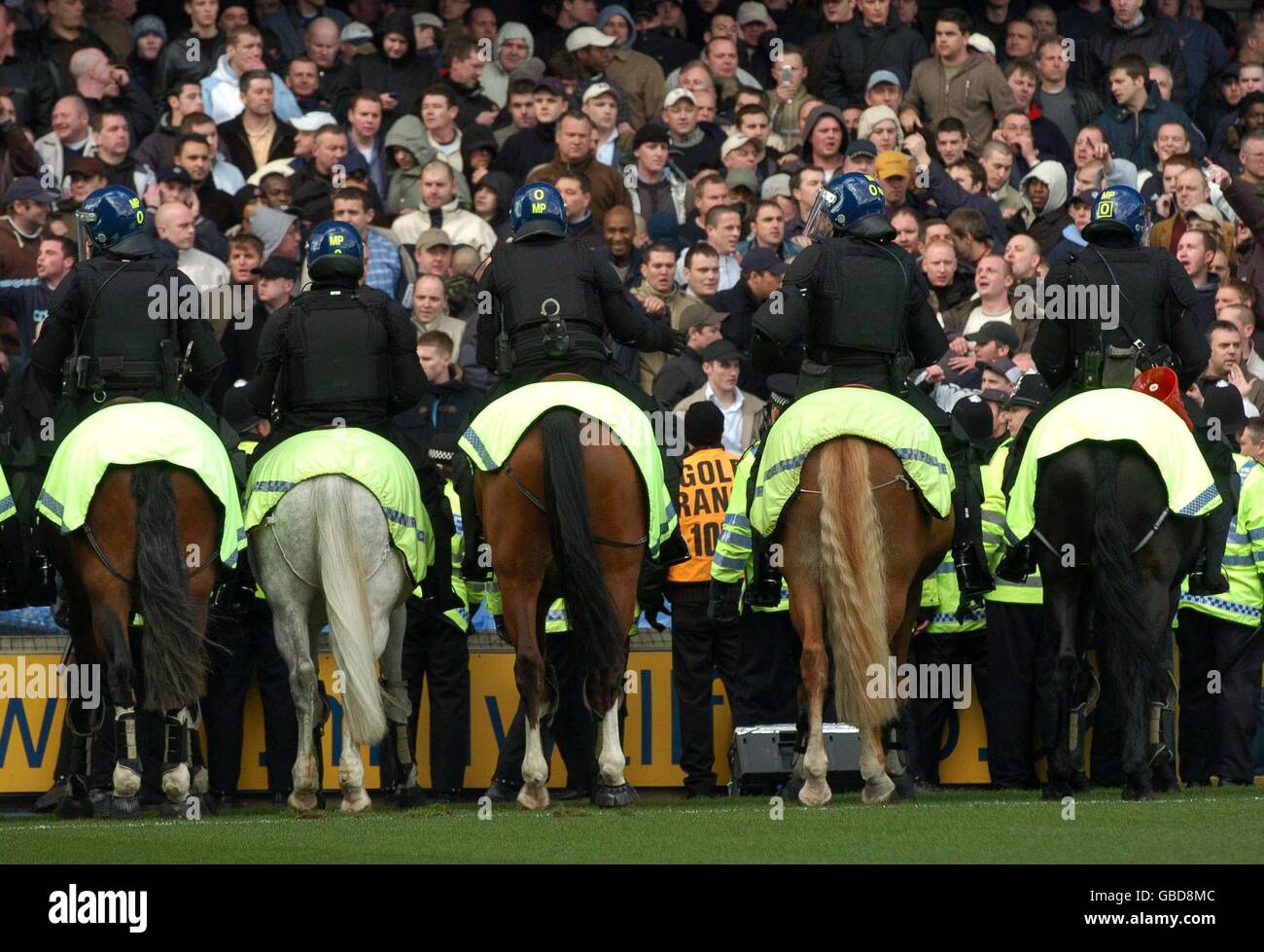 Soccer - Nationwide League Division One - Millwall v West Ham United. Police horses contain the West Ham fans Stock Photo