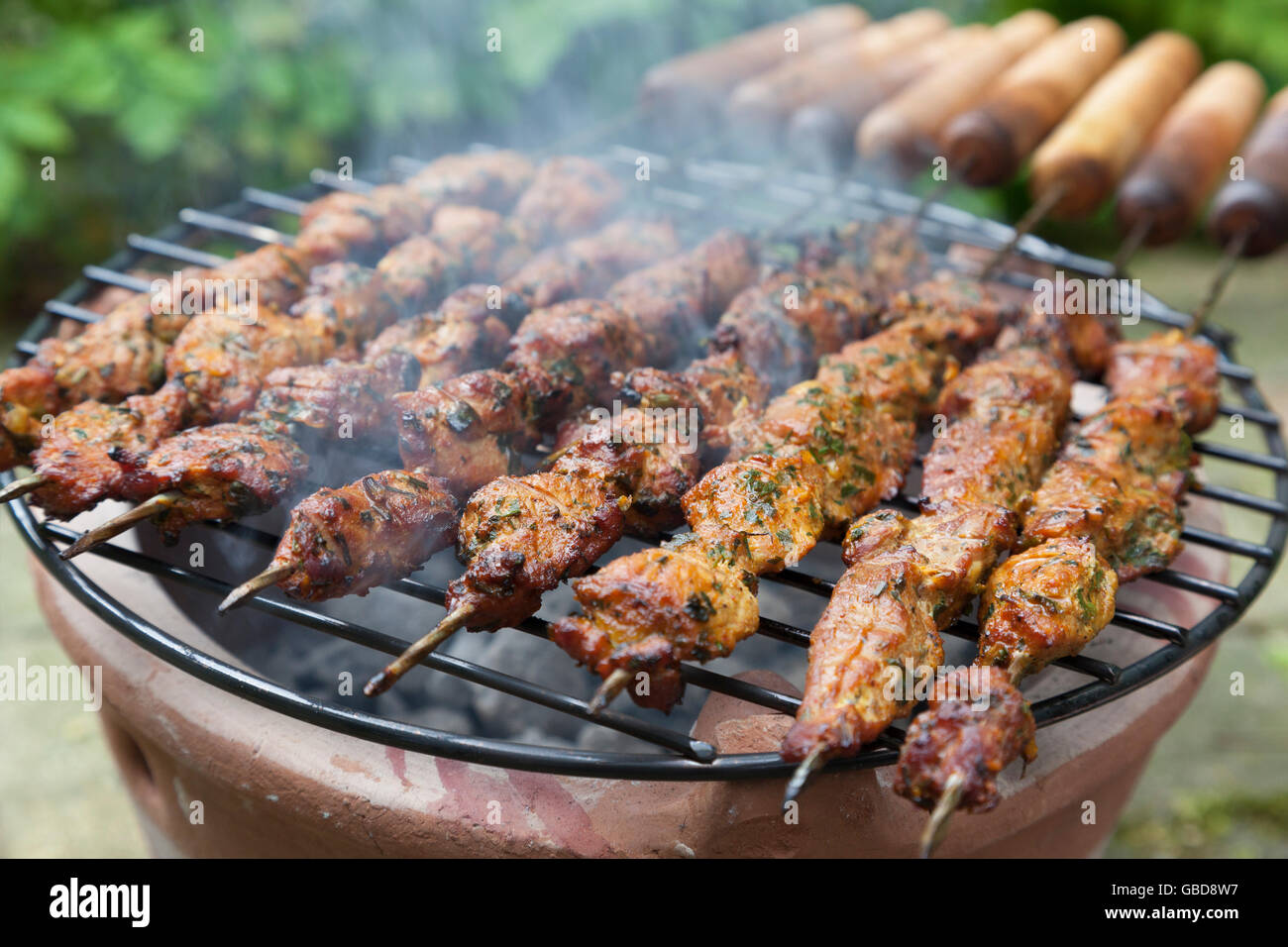 Baking  Moroccan lamb kebab on a stove outdoors Stock Photo