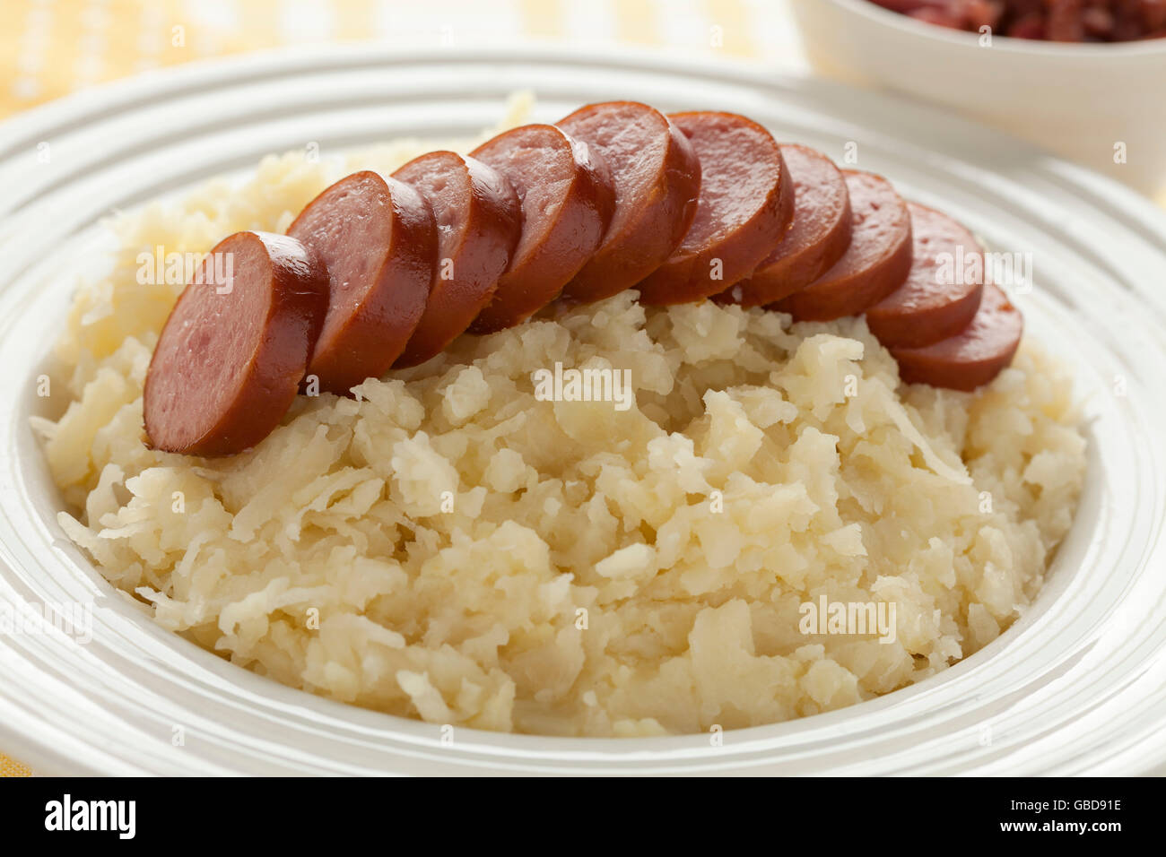 Traditional dutch meal with sauerkraut and sliced sausage Stock Photo