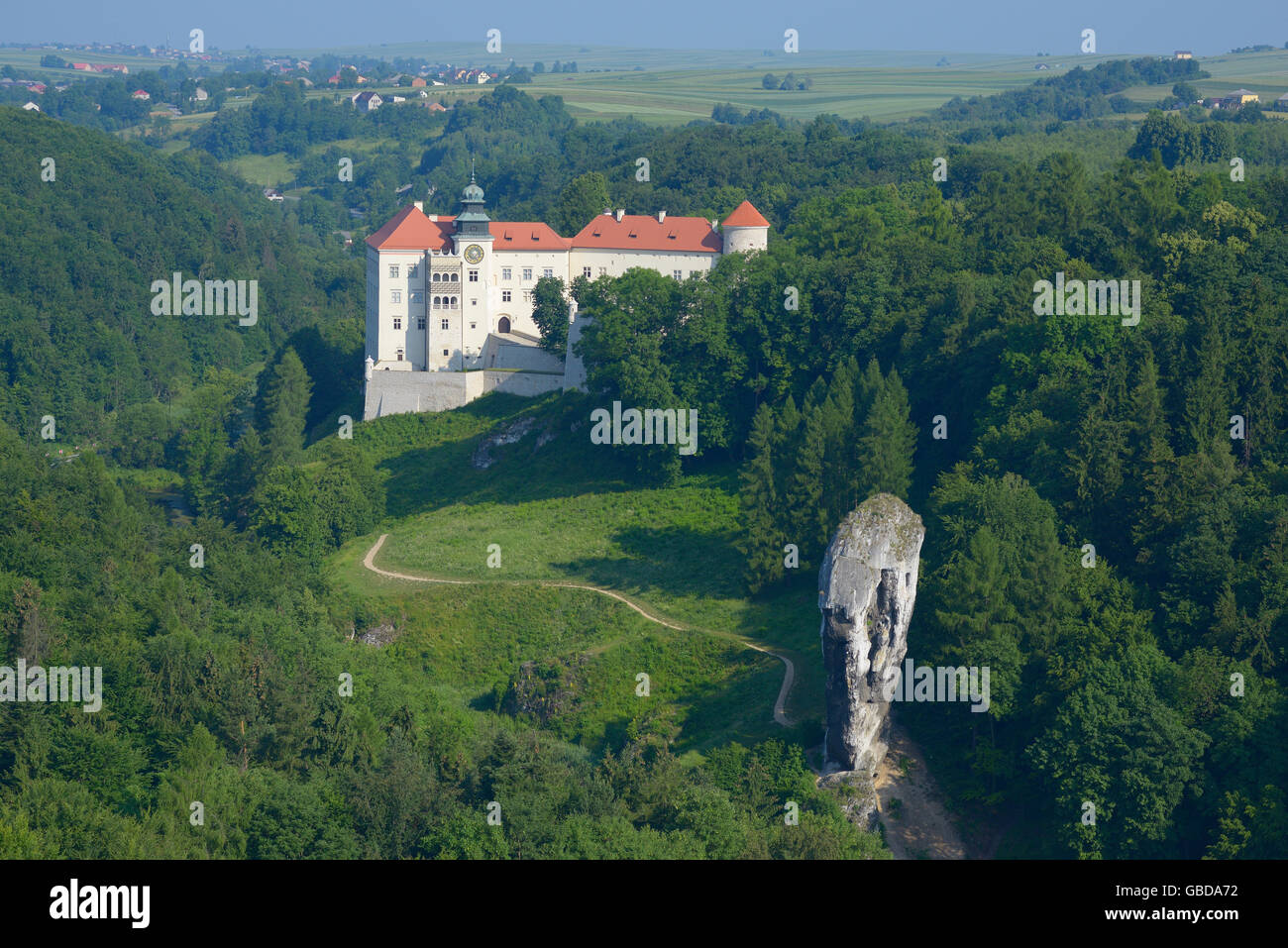 AERIAL VIEW. Pieskowa Skala Castle with its limestone monadnock in the foreground. Suloszowa, Lesser Poland Voivodeship, Poland. Stock Photo