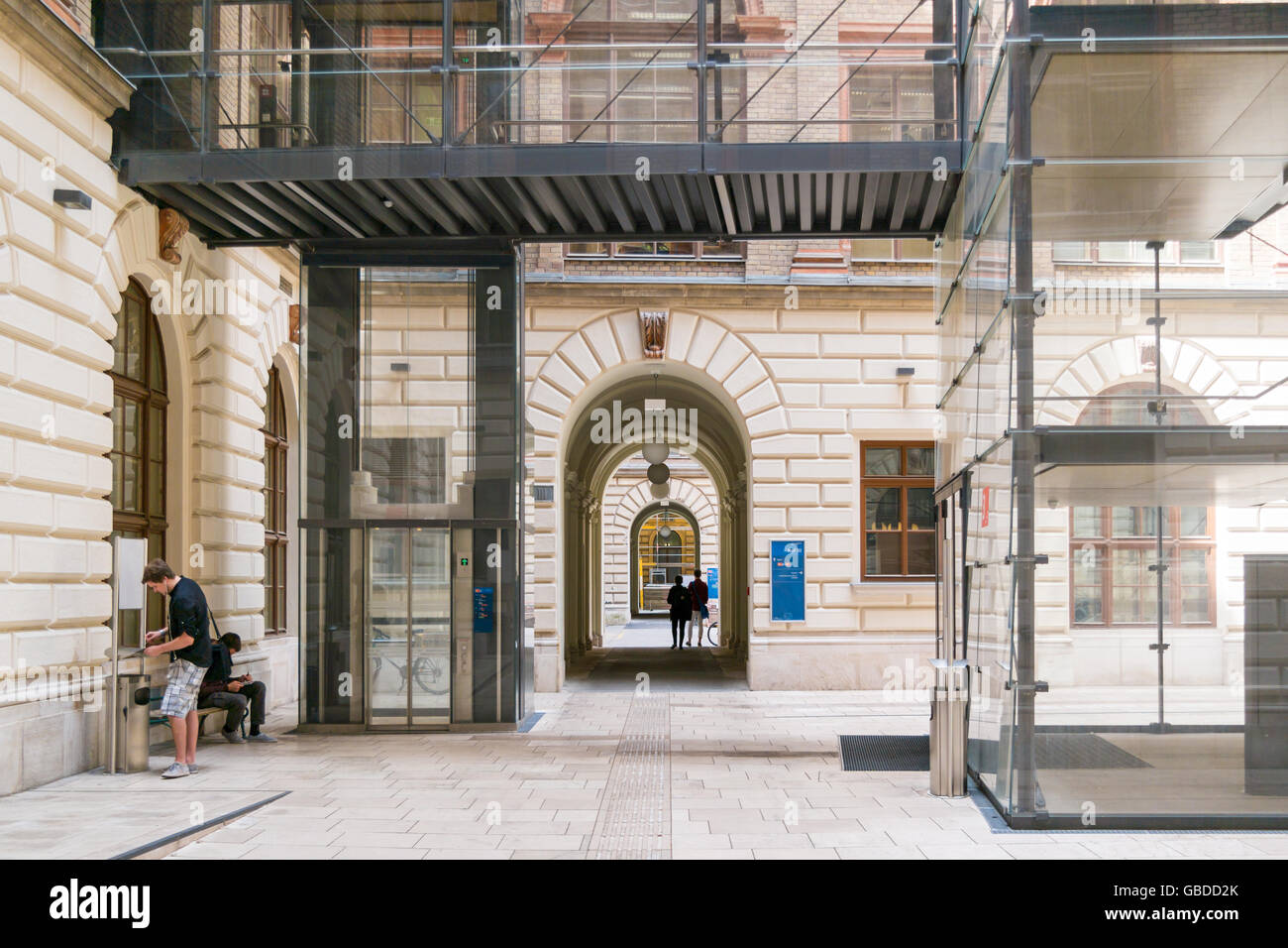 Court with people in main building of University on Ringstrasse in inner city of Vienna, Austria Stock Photo