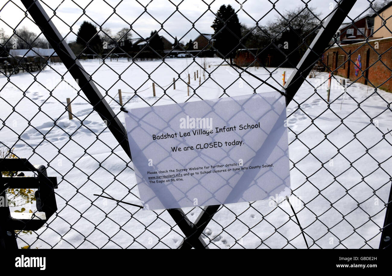 A sign is displayed on the gate of Badshot Lea Village Infant School