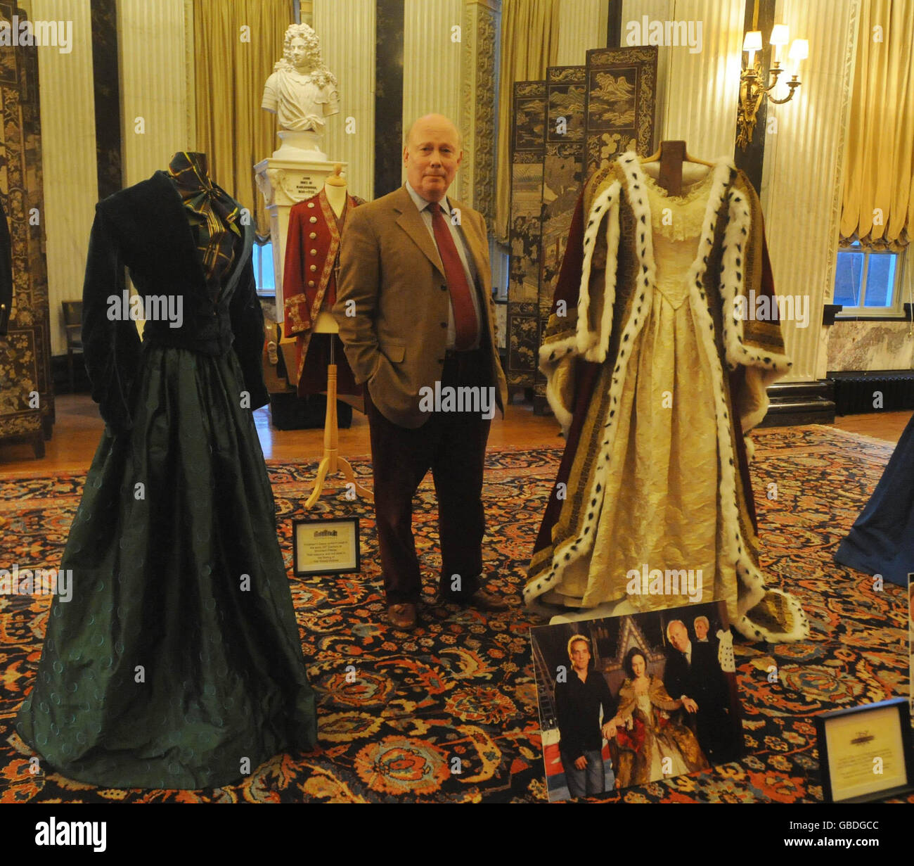 Julian Fellowes, with costumes from the film, The Young Victoria which is due to be released on March 6, inside an exhibition at Blenheim Palace, Woodstock. Stock Photo